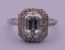 A platinum diamond and aquamarine ring. Ring size M/N.