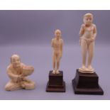 Three late 19th/early 20th century ivory figures. Seated figure 4.