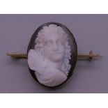 An unmarked gold framed carved cameo brooch. 3 cm high. 10.4 grammes total weight.
