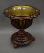 A Dutch wooden and brass coal bucket. 37.5 cm diameter.