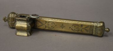 A 19th century Islamic brass scribes box. 24 cm long.