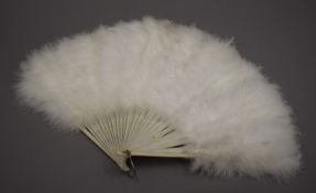 An ostrich feather fan. 34 cm long.