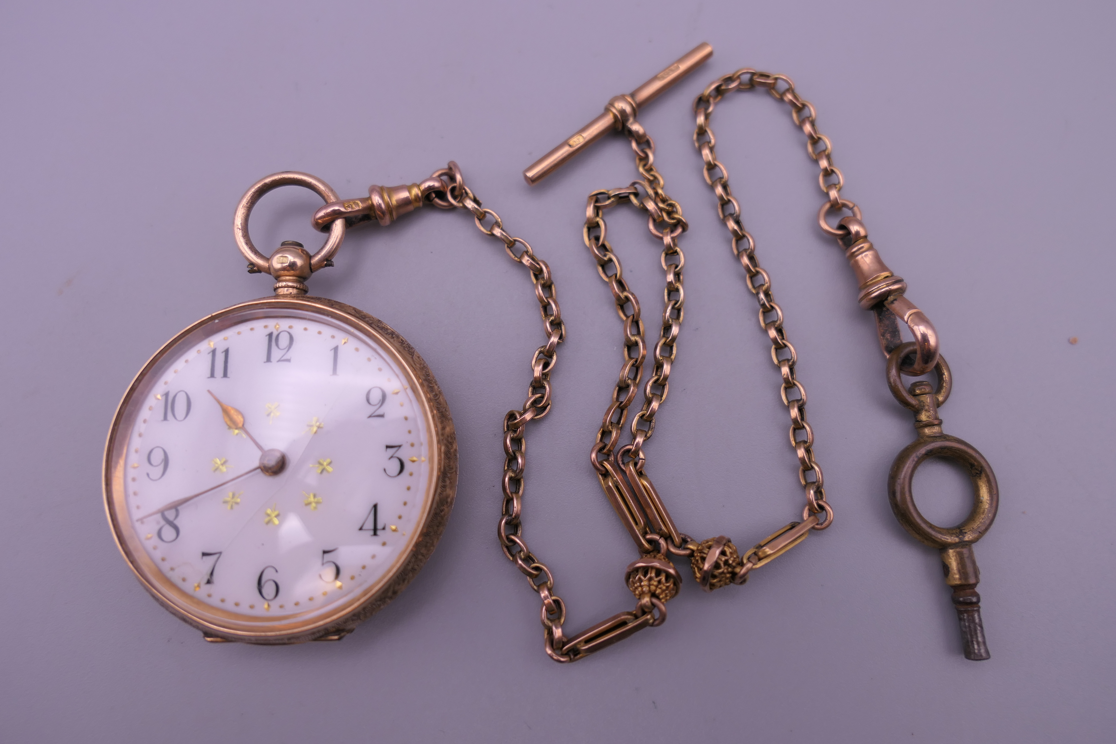 A ladies 14 K gold pocket watch (33 grammes total weight) on a 9 ct gold chain (7 grammes). Watch 3.