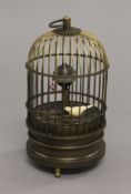 A birdcage clock. 14 cm high.