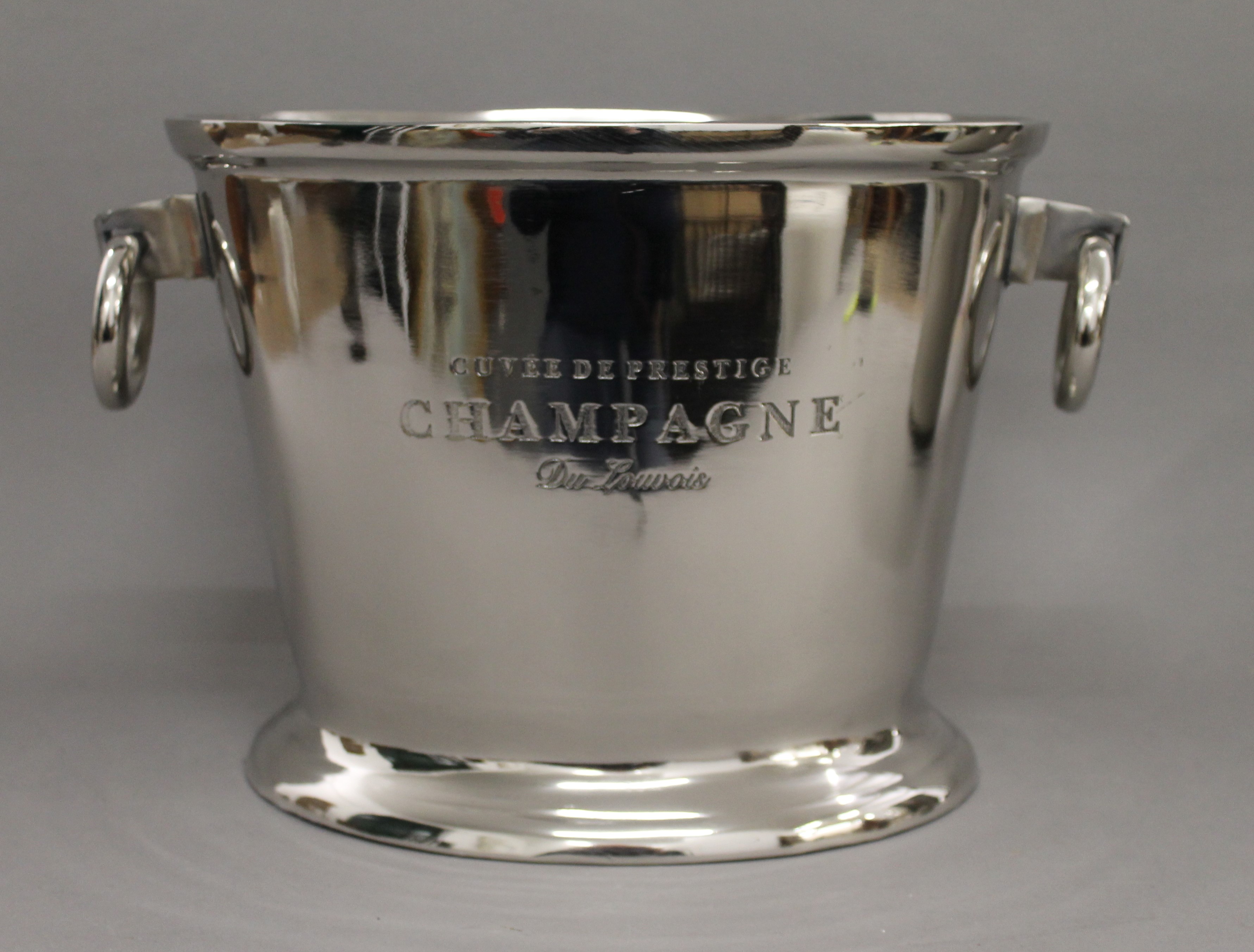 An oval champagne cooler with ring handle. 38 cm wide.