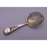 An early silver gilt filigree caddy spoon. 7.5 cm long. 8.1 grammes.