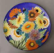 A Carltonware charger decorated with flowers. 32 cm diameter.