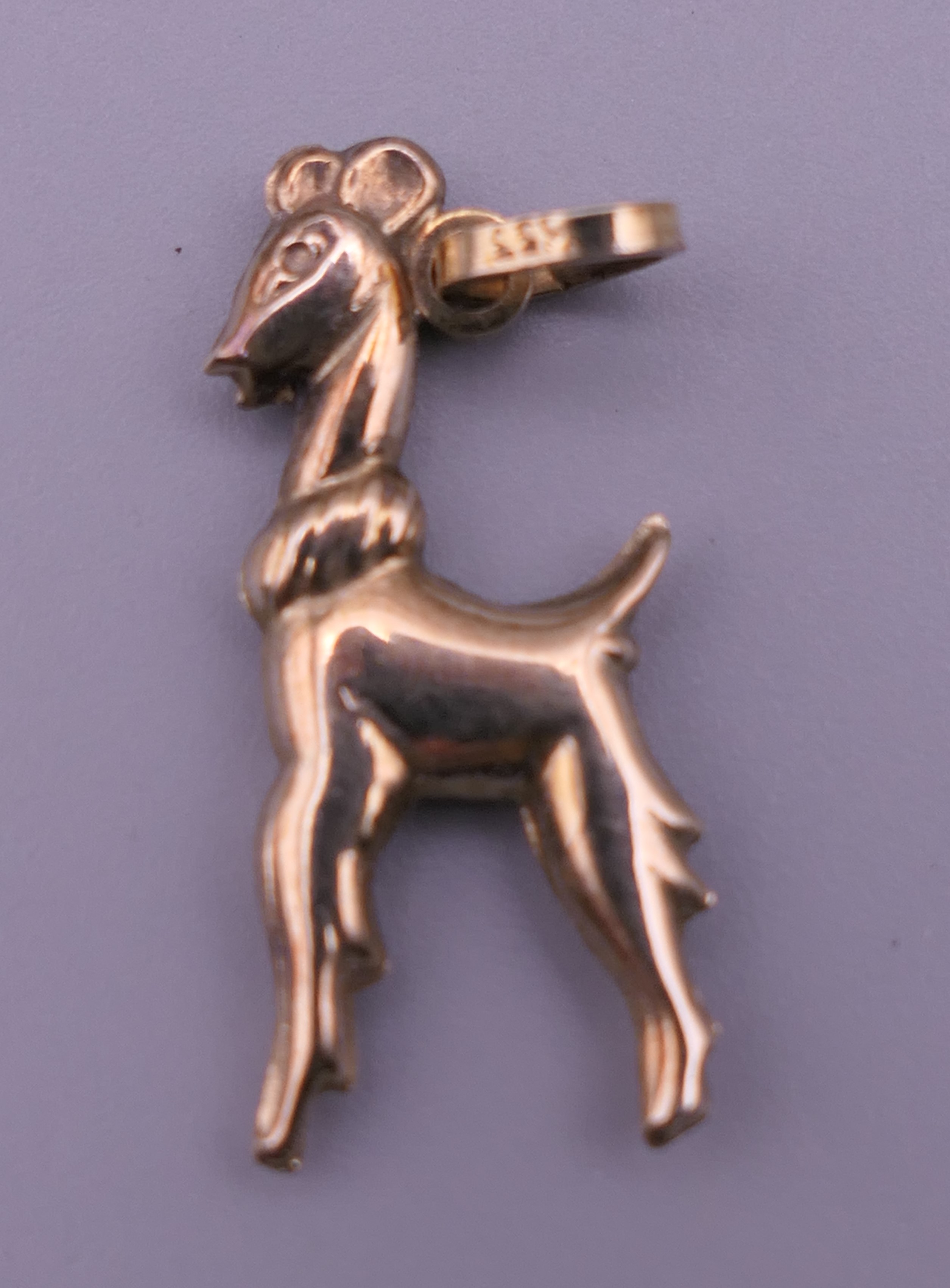 A gold pendant in the form of a deer. Pendant 2.5 cm high. 1.4 grammes.