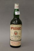 A vintage bottle of MacArthur's Select Scotch Whisky. 30 cm high.