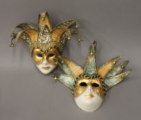 Two Venetian hand crafted masks. Each 25 cm high.