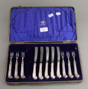 A quantity of silver handled cutlery in a case.