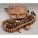 Two leather cartridge belts and a leather cartridge bag.