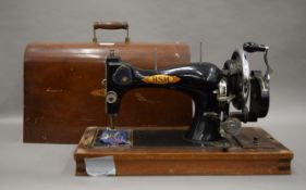 A boxed vintage sewing machine.