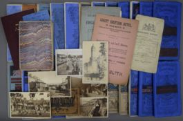 A collection of guide books, postcards, maps, etc.