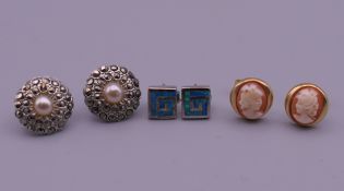 Three pairs of earrings. Cameo earrings 1 cm high.