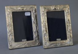 A pair of Art Nouveau style silver photograph frames. 14 x 19 cm.
