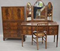 A 20th century mahogany dressing table and a small tallboy.