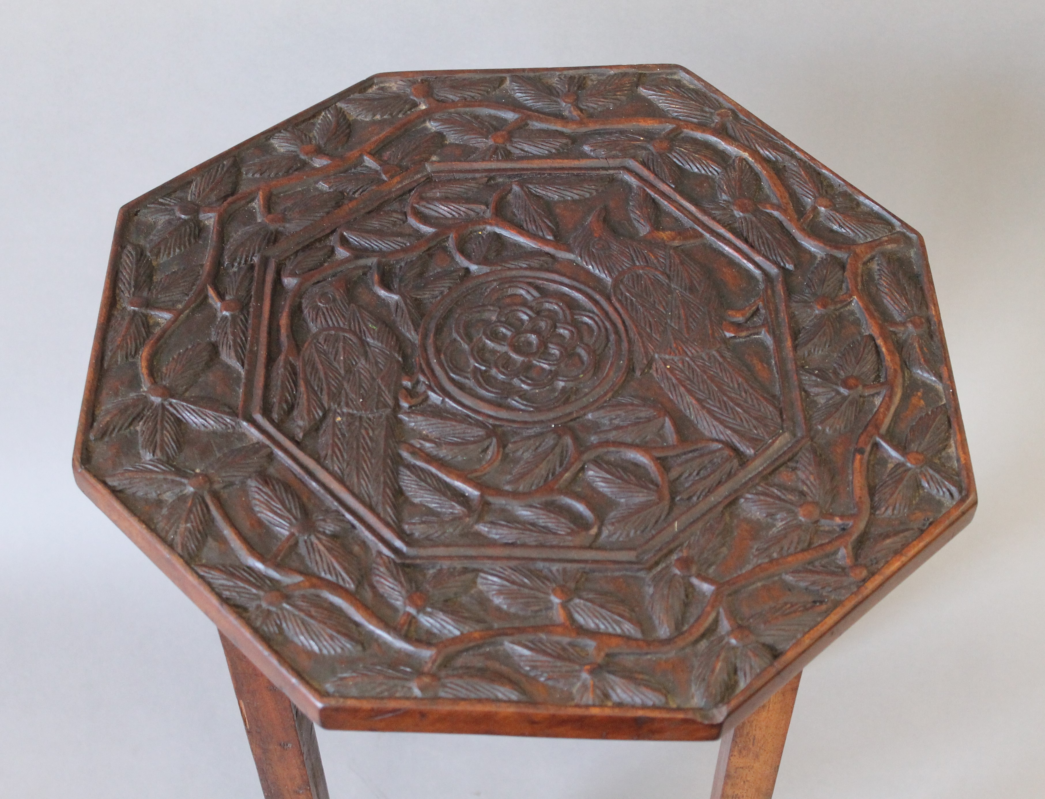 An Eastern carved octagonal side table, the top decorated with birds. 45 cm high. - Image 2 of 5