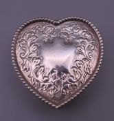 A heart shaped silver box. 5 cm wide. 38 grammes.