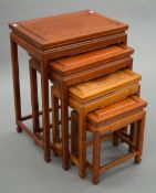 A Chinese nest of four tables. The largest 50.5 cm wide.
