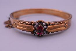 An antique bangle in a box. 6.5 cm wide.