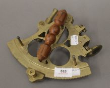 A brass sextant. 20.5 cm wide.