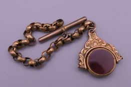 A 9 ct gold swivel fob on a plated chain. Fob 1.75 cm diameter, chain 13.5 cm long. The fob 5.