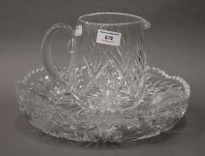 Two cut crystal glass plates and a jug. The latter 16 cm high.