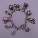 A silver charm bracelet. Approximately 18 cm long. 43.6 grammes.