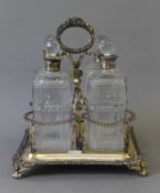A Georgian silver decanter stand, set with four associated silver collard cut glass decanters.