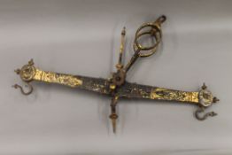 An 18th/19th century gilt painted hanging balance. 83 cm long.