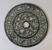 A Chinese pierced bi disc. 24.5 cm diameter.