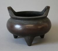 A Chinese bronze censer. 17 cm wide.