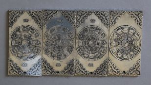 A set of four Chinese ingots. Each 5 cm wide.