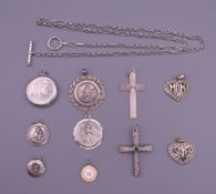 A collection of silver including two crosses, two St Christopher pendants, five other pendants,