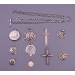 A collection of silver including two crosses, two St Christopher pendants, five other pendants,