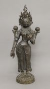 A Chinese bronze model of a deity. 50.5 cm high.