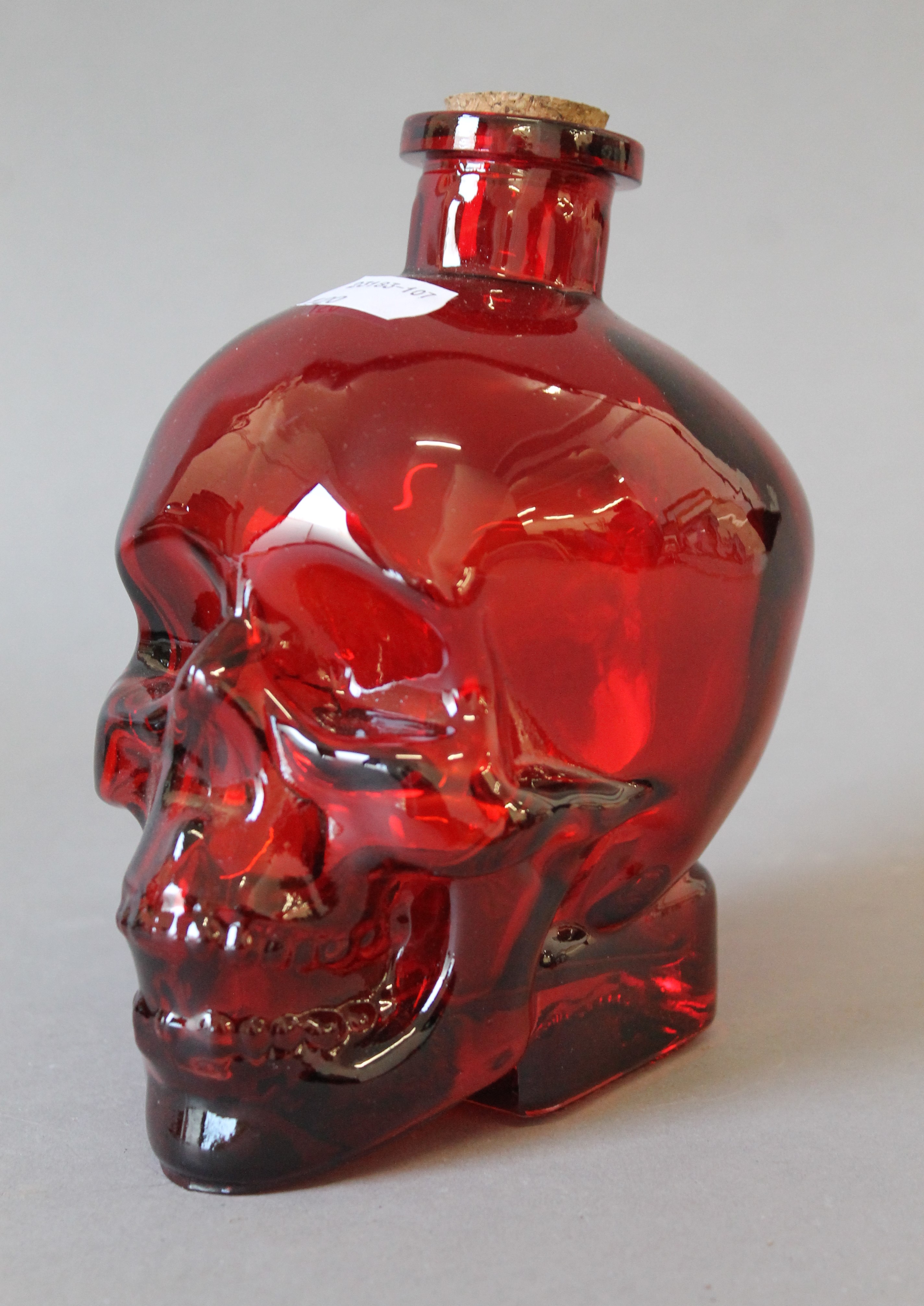 A red glass skull form decanter. 15 cm high. - Image 2 of 2