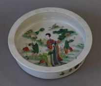 A Chinese famille verte porcelain shallow bowl. 21 cm diameter.
