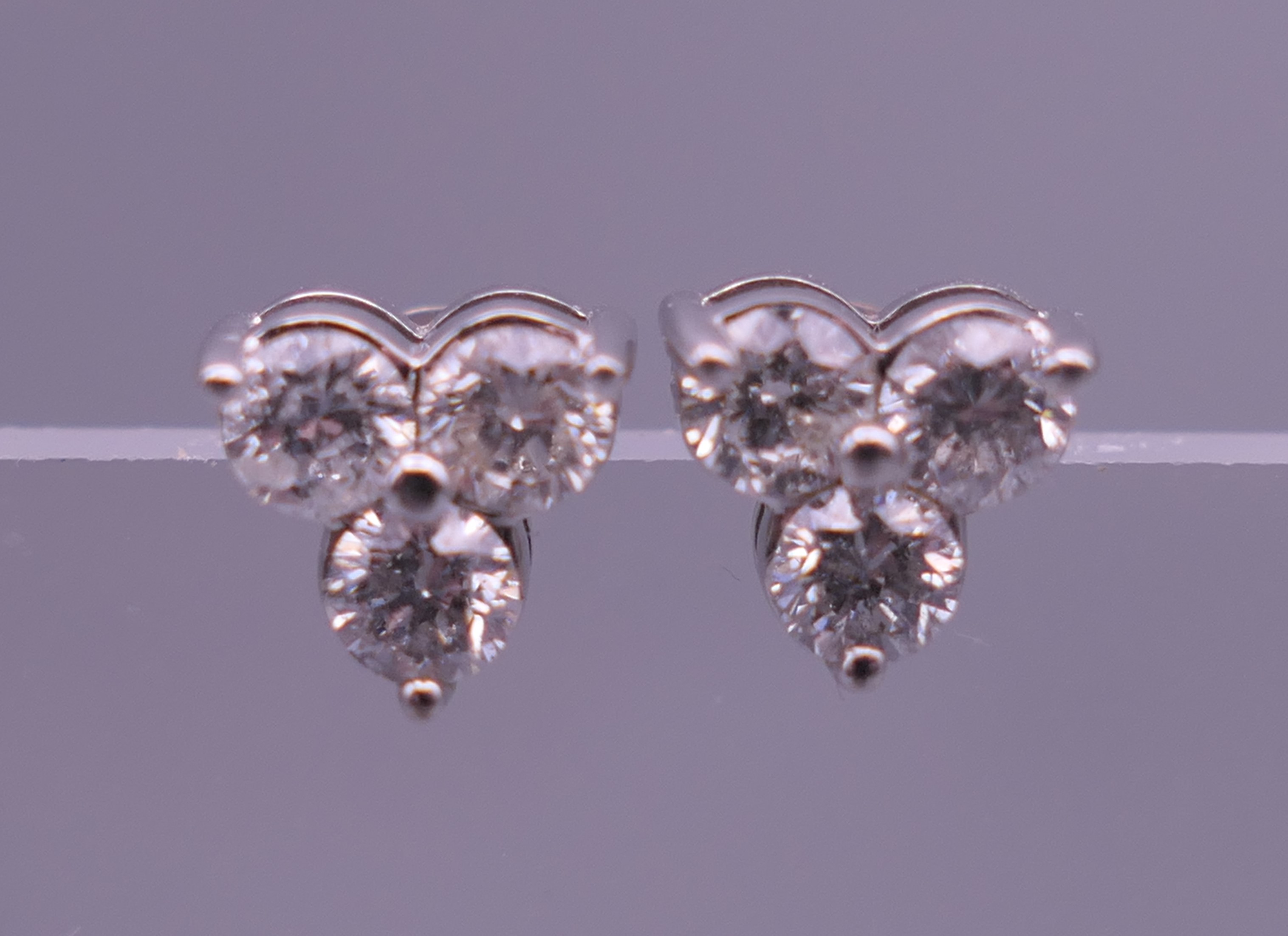 An 18 ct white gold and diamond necklace and pendant and a pair of matching earrings. - Image 8 of 8
