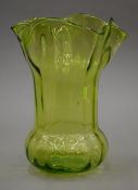 A fluted green glass vase. 28 cm high.
