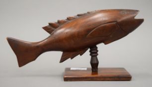 A carved wooden Pitcarn Island model of a fish.