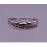 A white gold diamond set half hoop eternity ring. Ring size N.