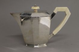 An Art Deco silver teapot. 16.5 cm high. 638.9 grammes total weight.