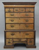 An 18th century walnut chest on stand (adapted). 111 cm wide, 153.5 cm high, 62.5 cm deep.