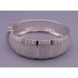 A ladies silver bracelet. 19 cm long. 28.4 grammes.