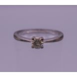 A 9 ct white gold diamond solitaire ring. Ring size M.