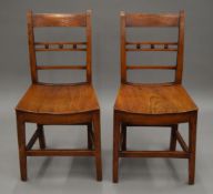 A pair of 19th century Suffolk elm chairs. 42.5 cm wide.