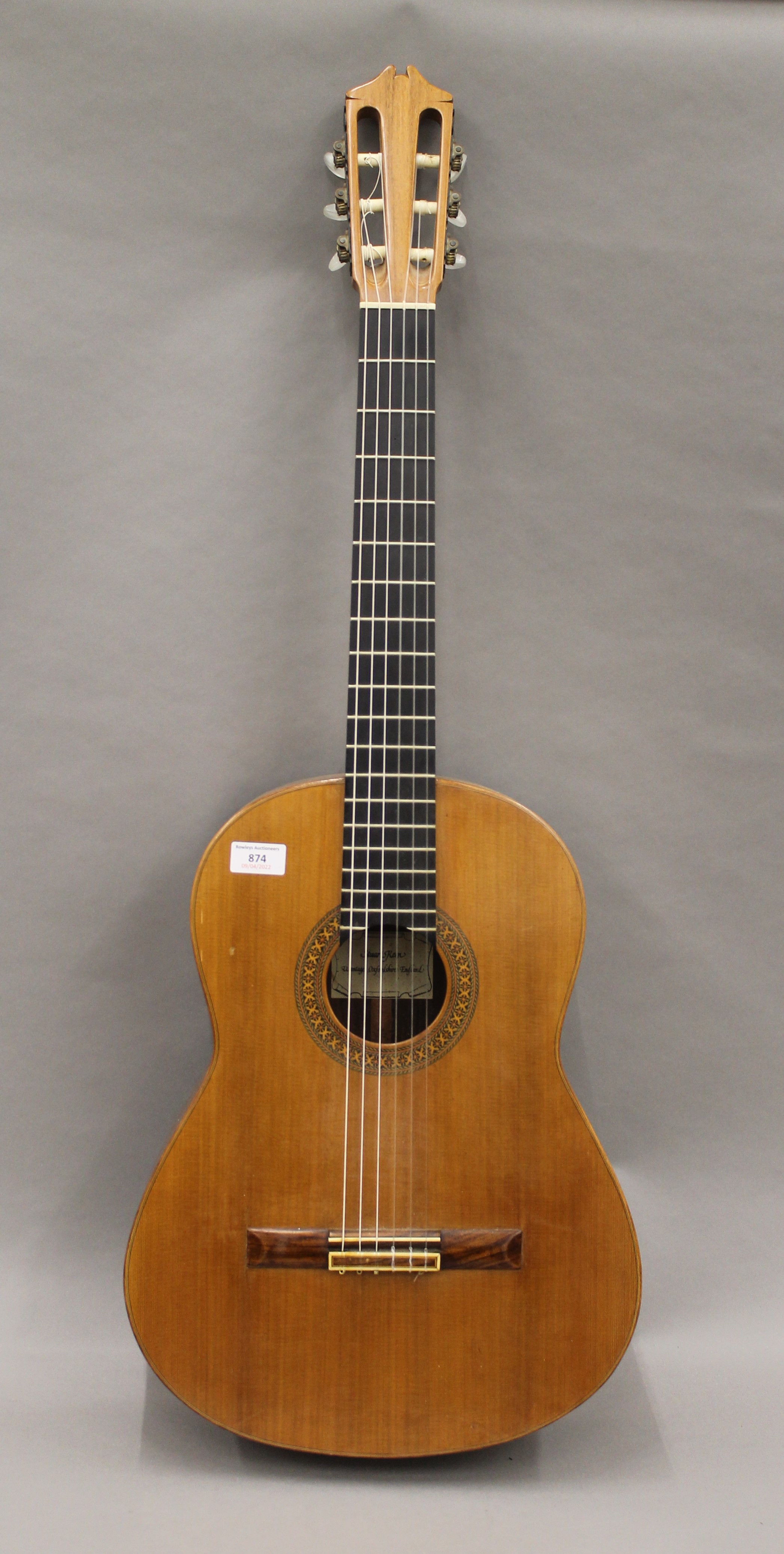 A Stuart Keen classical guitar. 99 cm high.