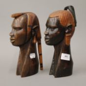 A pair of African carved wooden busts. The largest 24.5 cm high.